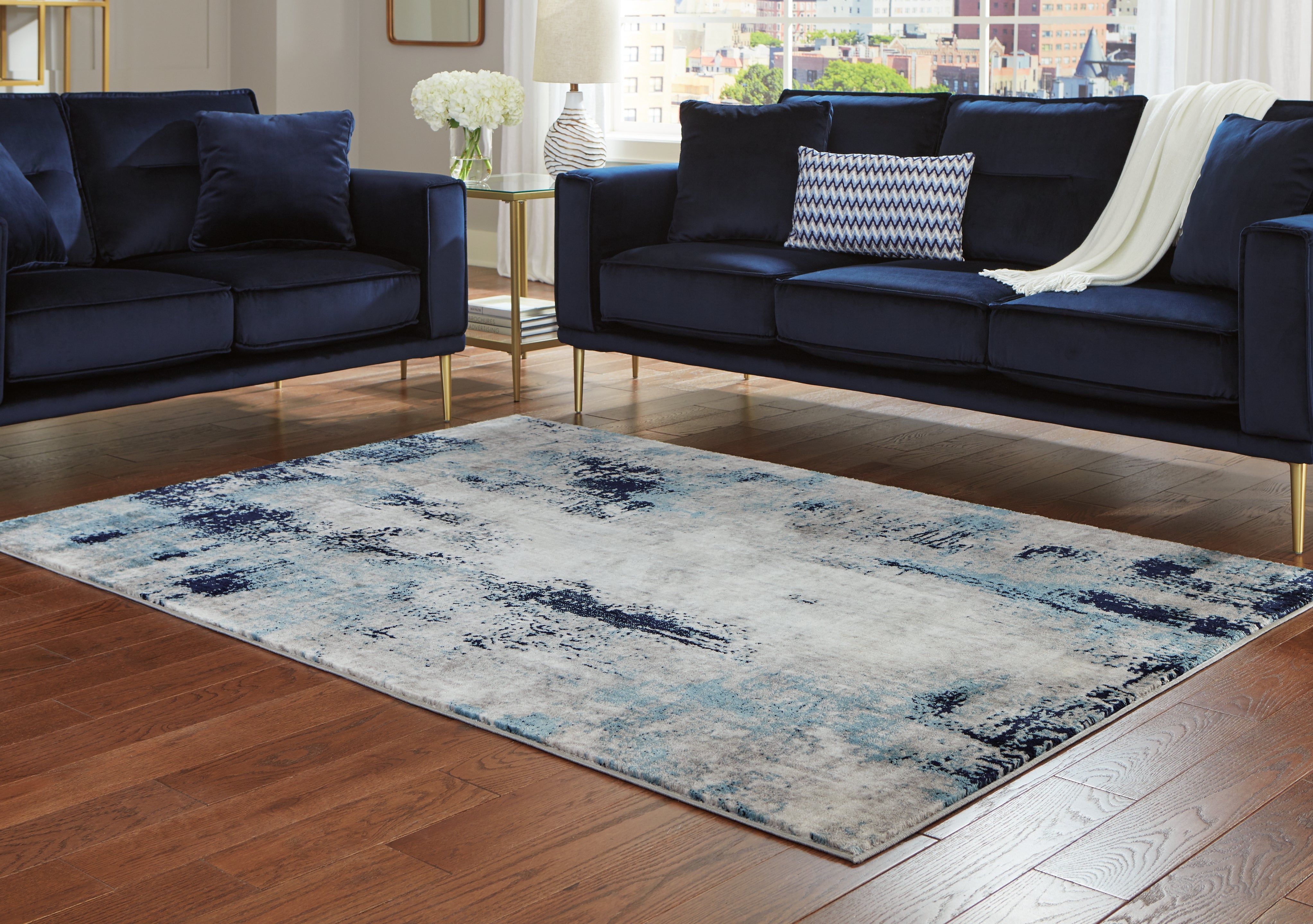 Luxury Living Gallery - Ashley Furniture - Leonelle Rug - 7'10" x 10' Rug / White/Blue/Gray - R404871