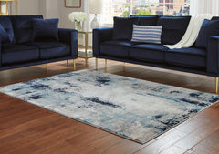 Luxury Living Gallery - Ashley Furniture - Leonelle Rug - 7'10" x 10' Rug / White/Blue/Gray - R404871