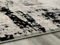 Luxury Living Gallery - Ashley Furniture - Zekeman Rug - 7'10" x 10' Rug / Black/Cream/Gray - R404921