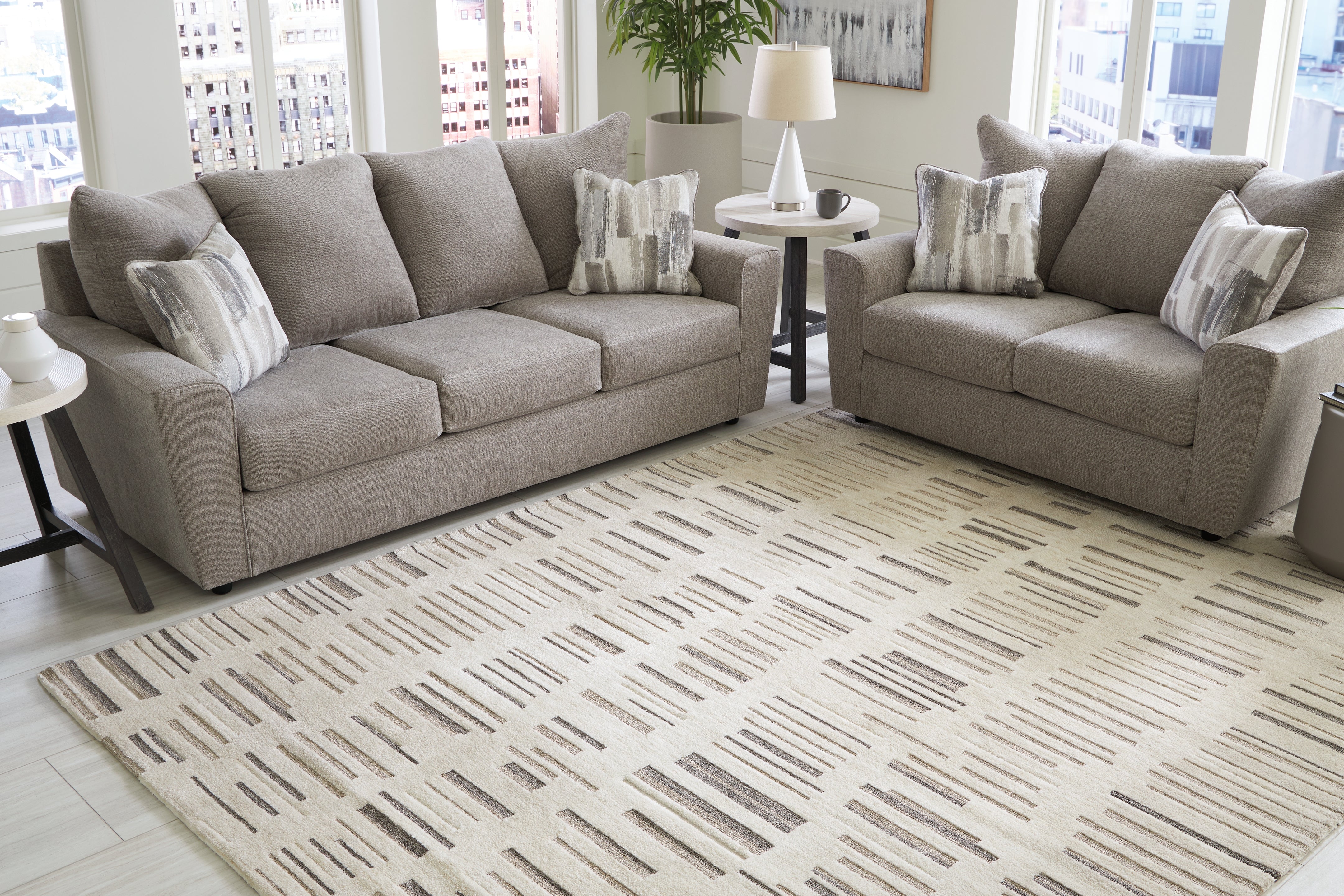 Luxury Living Gallery - Ashley Furniture - Leesdale Rug - 5' x 7' Rug / Ivory/Brown/Black - R406422