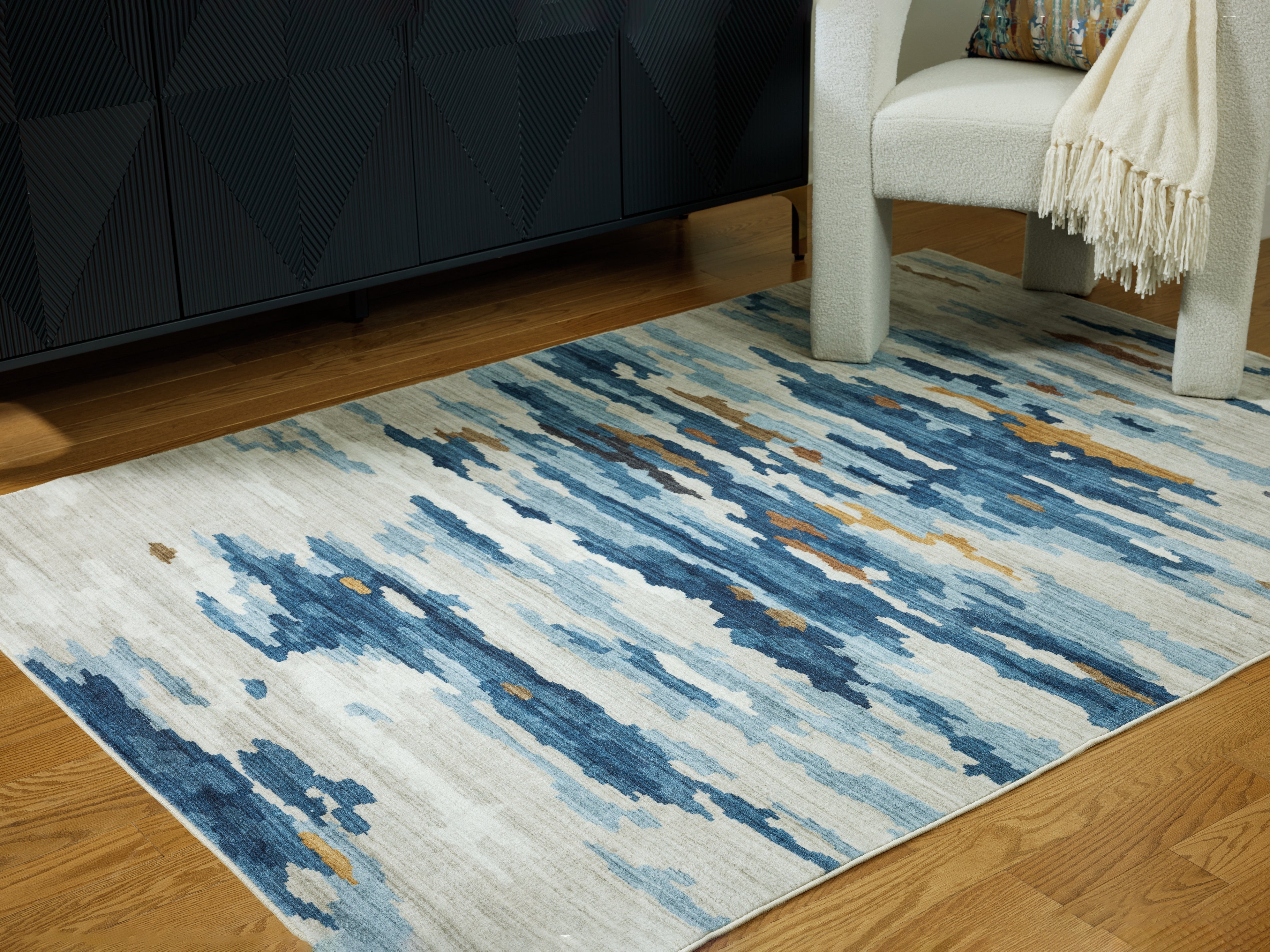 Luxury Living Gallery - Ashley Furniture - Vinlett Rug - 5' x 7' Washable Rug / Cream/Blue/Brown - R407042