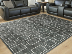Luxury Living Gallery - Ashley Furniture - Elderland Rug - Washable 5' x 7' Area Rug / Black/Gray - R407402