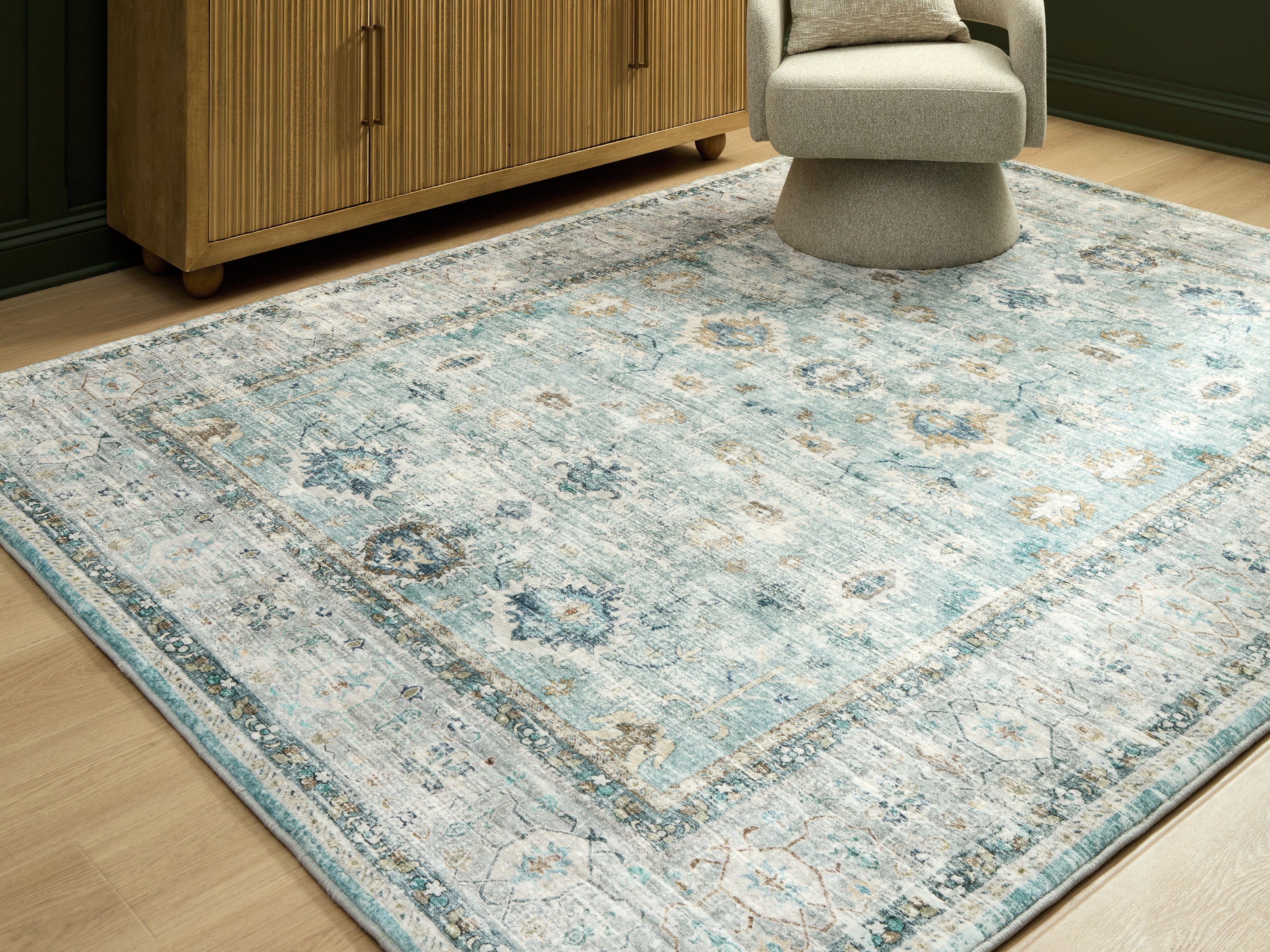 Luxury Living Gallery - Ashley Furniture - Ladstoney Rug - 7'6" x 9'6" Area Rug / Teal/Beige/Ochre - R407501