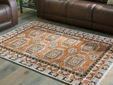 Luxury Living Gallery - Ashley Furniture - Qaabiz Rug - 5' x 7' Area Rug / Sienna/Ivory/Black - R407522