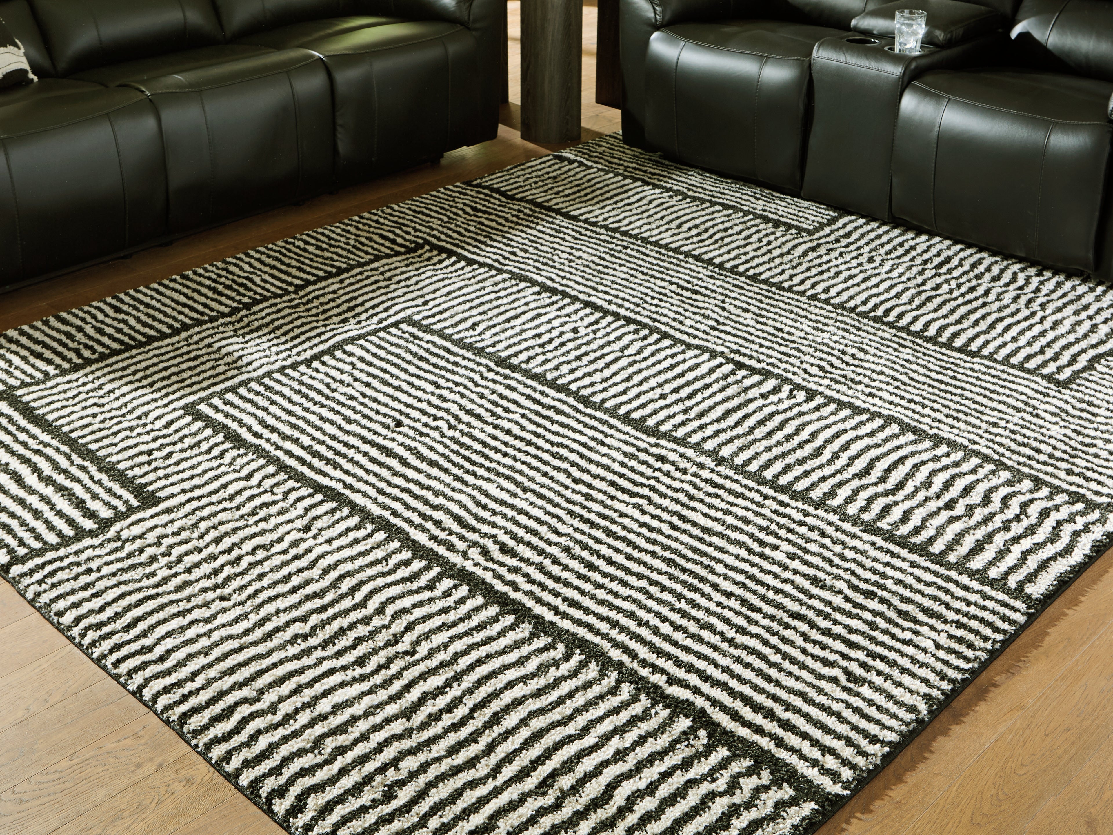 Luxury Living Gallery - Ashley Furniture - Kurtmen Rug - 7'10" x 9'10" Area Rug / Black/Ivory - R407591