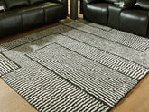 Luxury Living Gallery - Ashley Furniture - Kurtmen Rug - 7'10" x 9'10" Area Rug / Black/Ivory - R407591