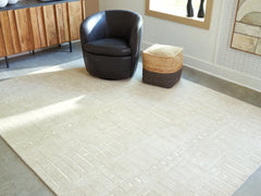 Luxury Living Gallery - Ashley Furniture - Wolbert Rug - 5' x 7' Area Rug / Tan/Ivory - R407662
