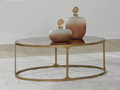 Luxury Living Gallery - Ashley Furniture - Korajane Coffee Table - Oval Cocktail Table / Antique Gold - T399-0