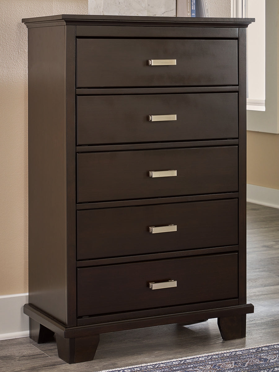Luxury Living Gallery - Ashley Furniture - Covetown Bedroom - Five Drawer Chest / Dark Brown - B441-46