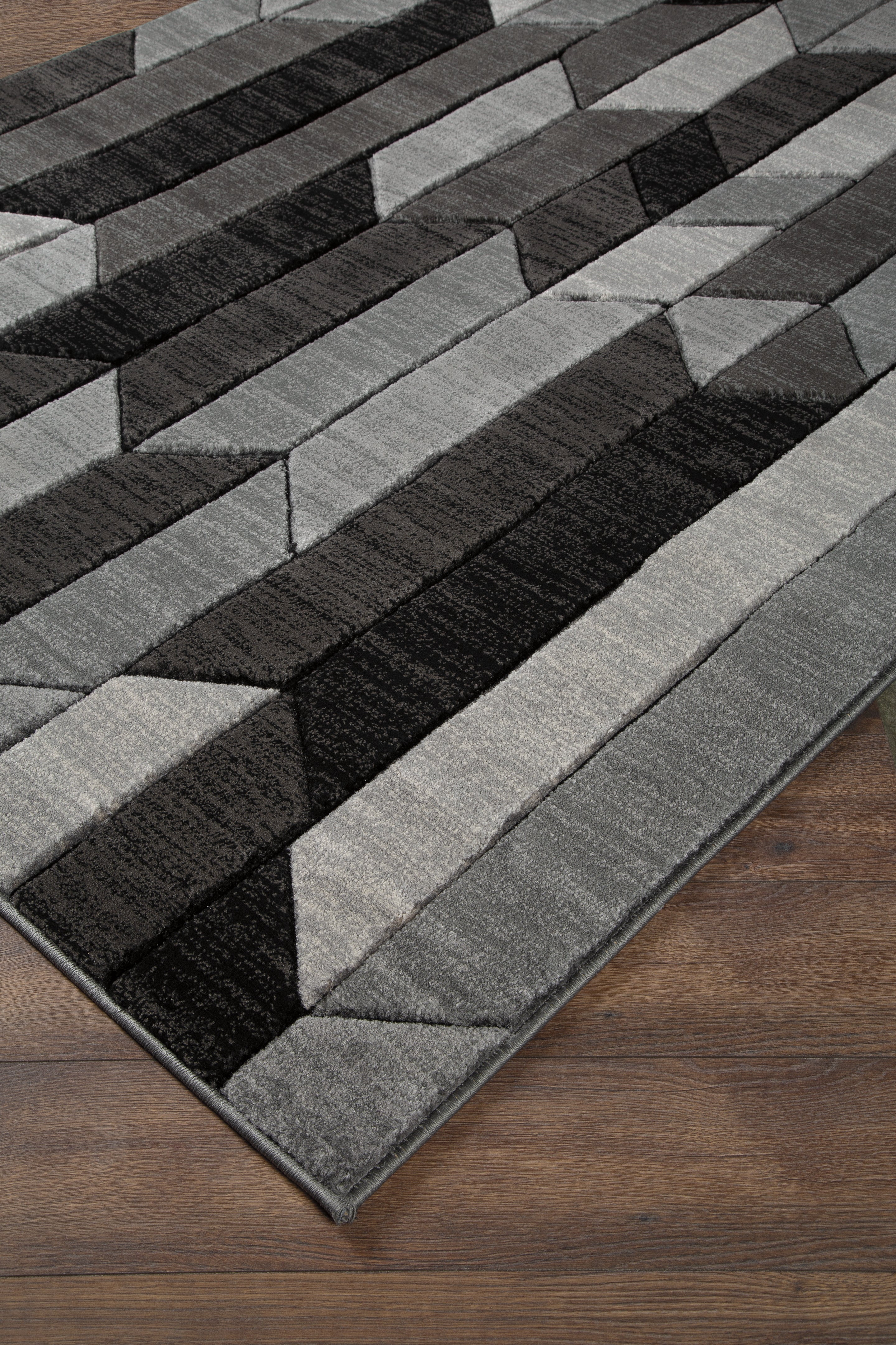 Luxury Living Gallery - Ashley Furniture - Chayse Rug - 6'6" x 9'6" Rug / Black/Gray - R403461