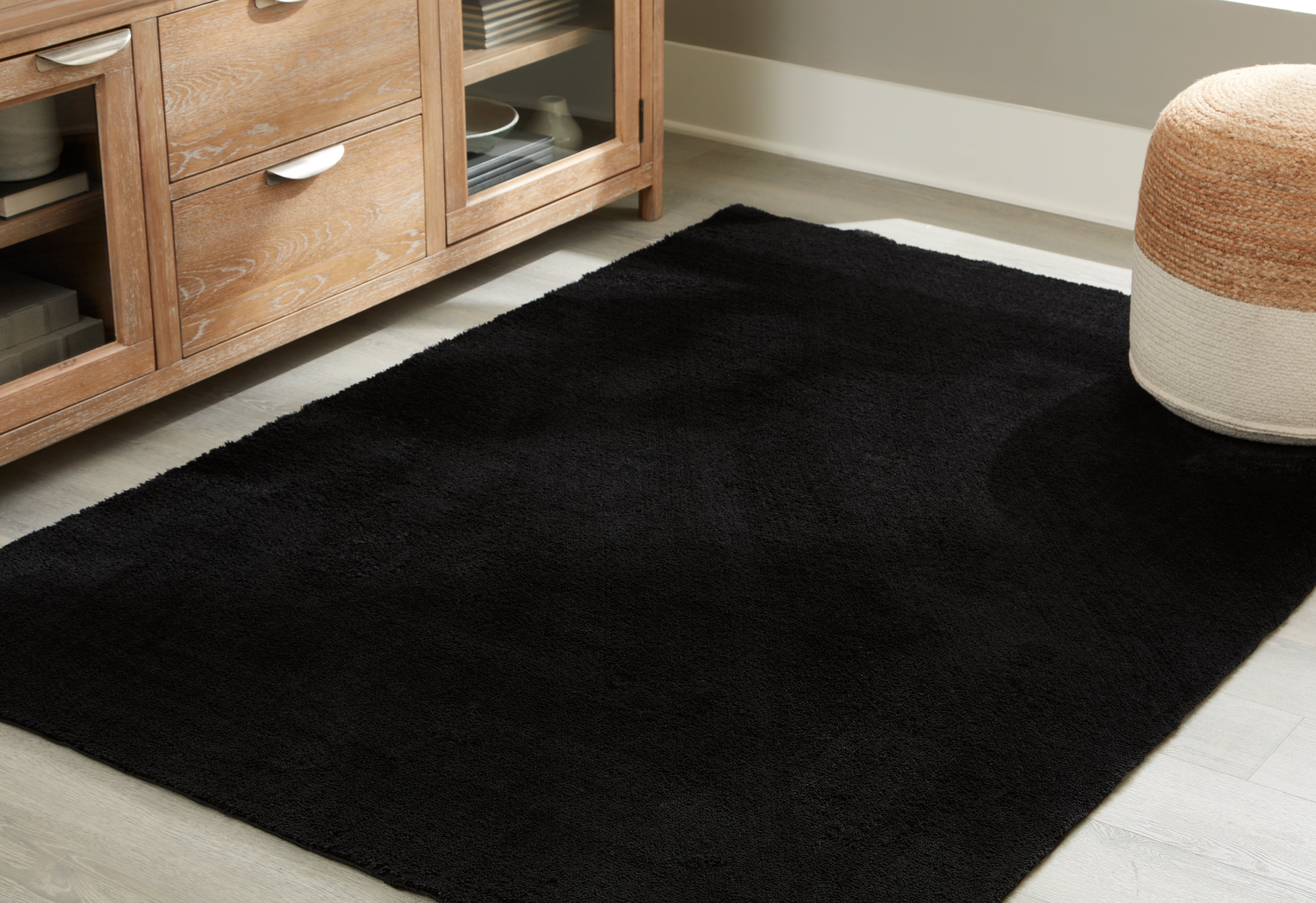 Luxury Living Gallery - Ashley Furniture - Anaben Rug - 8' x 10'1" Washable Rug / Black - R406311
