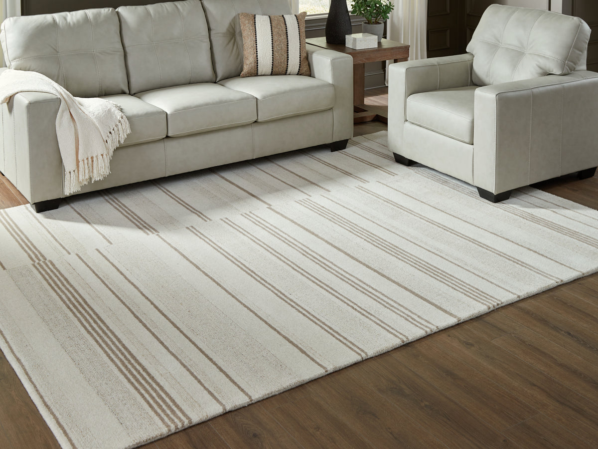 Luxury Living Gallery - Ashley Furniture - Gadence Rug - 7'8" x 10' Area Rug / Ivory/Tan - R407641